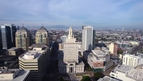 Aerial-View-of-Oakland-City-Hall-and-Downtown-Buildings-on-Sunny-Day,-California-USA,-Drone-Shot