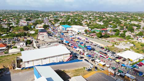 Panoramic-orbit-above-Carnaval-Grand-March-lining-streets-of-Curacao-at-midday-for-festivities