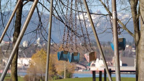 Empty-Playground-Swings-Blowing-Gently-in-the-Wind---Sunny-Day-in-Park