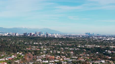 Drone-aerial-view-of-both-west-hollywood,-and-los-angeles-skyline