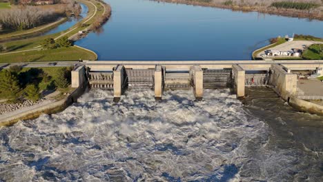 Aerial-establishing-shot-of-water-flowing-through-the-Villeneuve-Dam-in-Avignon
