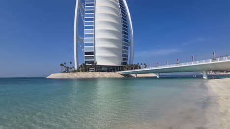 Burj-Al-Arab,-Waterfront-Landmark-of-Dubai-UAE,-Tilt-Up