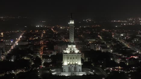 Aerial-View,-Monumento-a-Los-Heroes-de-la-Restauracion-at-Night,-Santiago-De-Los-Caballeros,-Dominican-Republic