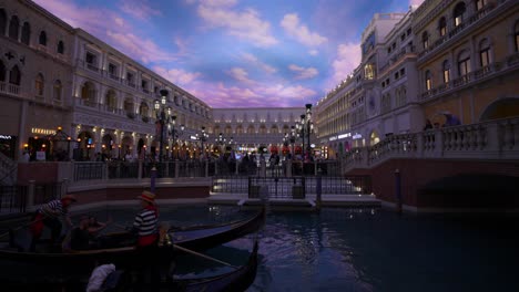 Wide-angle-interior-of-mall-at-the-Venetian-with-gondolas-and-painted-sky,-Las-Vegas