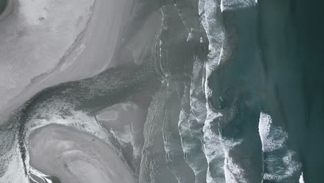 A-lagoon-mouth-that-is-open-to-the-ocean-as-seen-from-above