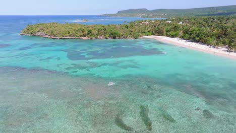 La-Playita-beach-with-shallow-and-transparent-waters,-Las-Galeras-in-Samana-peninsula,-Dominican-Republic
