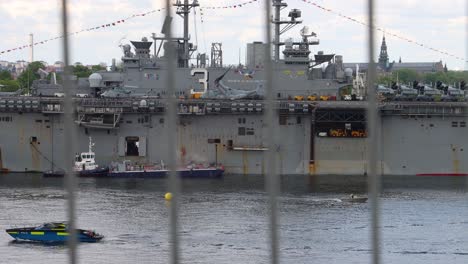 Battleship-USS-Kearsarge-and-other-boats-seen-through-metal-bars