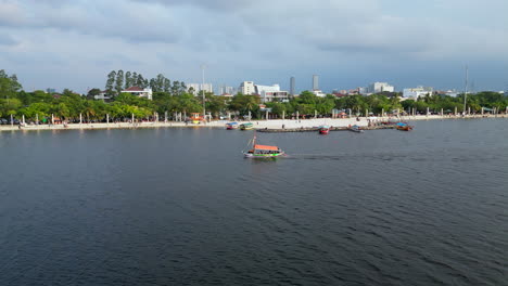 Small-Boat-Traces-The-Ancol-Beach-Shore-At-Sunset-In-Jakarta-Indonesia
