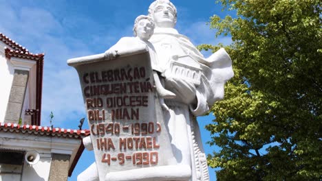 Religious-saint-statue-with-scroll-in-Church-of-Saint-Anthony-of-Motael,-oldest-Roman-Catholic-church-in-Timor-Leste,-in-the-capital-city-of-East-Timor,-Southeast-Asia