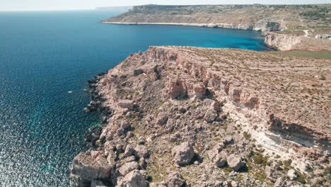 Malta,-coast-aerial-revealing-coastline,-cliffs