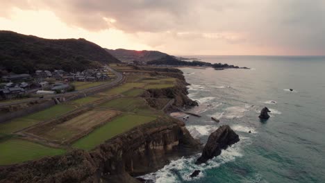 Aerial-Japanese-landscape-cliff-at-Kyotango-beach-Kansai-Japan-Fields-with-sea-and-sunset-dramatic-gradient-Sky,-golden-hour-landscape