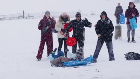 A-Family-Having-Fun-Snow-Sledding-At-The-Winterly-Woluwe-Park-Near-Brussels-In-Belgium