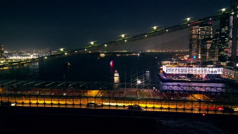 Panning-left-across-river-from-the-Manhattan-side-of-the-Brooklyn-Bridge-at-night