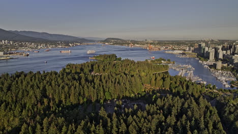 Vancouver-BC-Canada-Aerial-v50-drone-flyover-Stanley-Park-capturing-Coal-harbour-downtown-cityscape,-marina,-yacht-club-and-North-shore-mountain-views---Shot-with-Mavic-3-Pro-Cine---July-2023