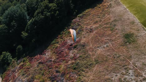 Aerial-shot-of-a-paraglider-gliding-peacefully-through-the-air