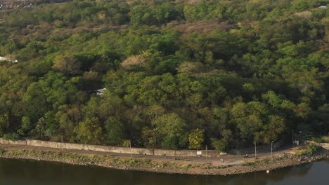 Aerial-drone-view-is-a-camera-where-many-people-are-visible-and-many-birds-are-swimming-in-the-water