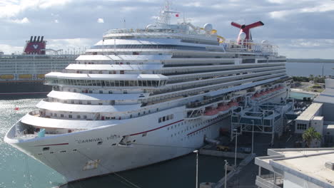 Experience-the-excitement-of-embarkation-as-Carnival-Cruise-ship-rests-at-the-terminal-cruise-port,-welcoming-tourists-aboard-for-memorable-voyage-in-this-captivating-video-backdrop