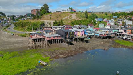 Aerial-view-around-of-Palafitos-stilt-houses-on-the-coast-of-Castro,-Chiloe