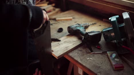 The-Man-Employs-a-Saw-to-Shape-the-Edge-of-the-Wooden-Plank-Intended-for-the-DIY-Hot-Tub---Close-Up