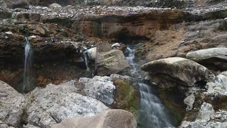 Small-Waterfalls-Flowing-Through-Rocky-Cliff-At-Boise-National-Forest