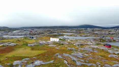 Aerial:-lake-and-plateau-in-Bjørnfjell,-Bjørnfjell-Chapel,-in-northern-Norway-and-close-to-Sweden