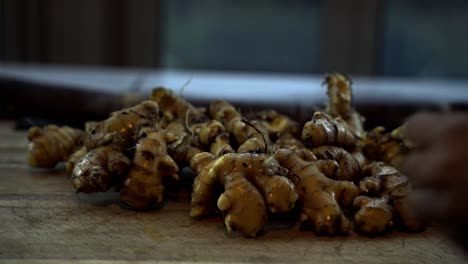 Adding-ginger-to-a-table-after-it-was-harvested-cleaned-and-washed-home-gardening-ginger-harvest-agriculture