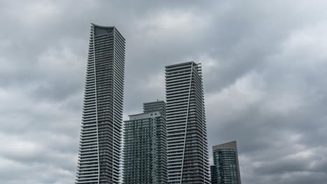 Static-timelapse-of-clouds-moving-over-skyscrapers-in-central-Toronto