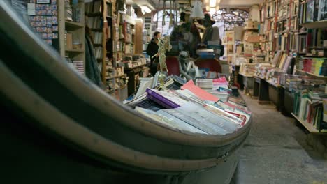 Iconic-Venetian-bookstore-Libreria-Acqua-Alta-with-gondola-shelving