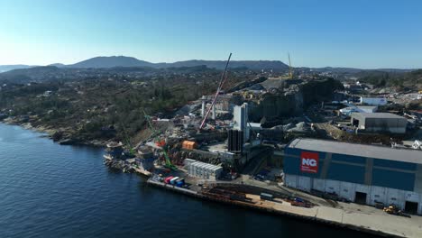 Construction-work-while-building-new-highway-bridge-to-Sotra-Norway,-Aerial