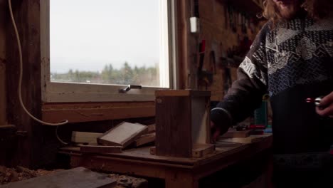 Man-Busy-At-His-Workshop-Making-Wooden-Box-And-Fasten-With-A-Screw