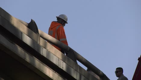 Caltrans-workers-walk-across-bridge