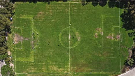 Hyperlapse-of-a-soccer-field,-players-move-together