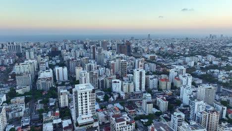 Aerial-establisher-city-Domingo,-Dominican-Republic-at-blue-hour,-cityscape