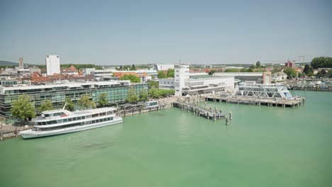 Handheld-shot-of-Friedrichshafen-cityscape-with-Zeppelin-Museum-on-sunny-day