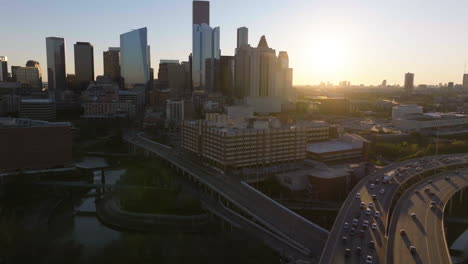 Aerial-view-approaching-the-University-of-Houston-Downtown,-sunrise-in-Texas,-USA