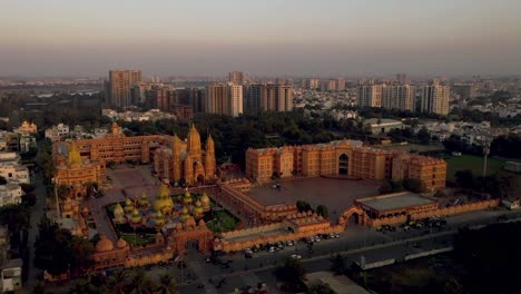 Aerial-drone-view-A-big-grand-temple-is-visible-and-many-people-are-also-visible-and-many-buildings-and-bushes-are-also-visible-around