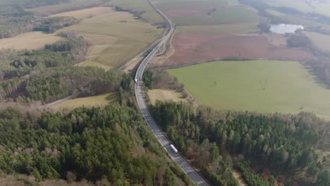 Road-with-passing-cars-and-trucks