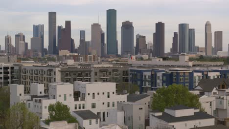 Pushing-forward-drone-shot-of-downtown-Houston-and-surrounding-cityscape