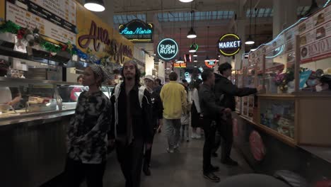 Diverse-crowd-shops-at-Grand-Central-Market-in-downtown-Los-Angeles,-pov