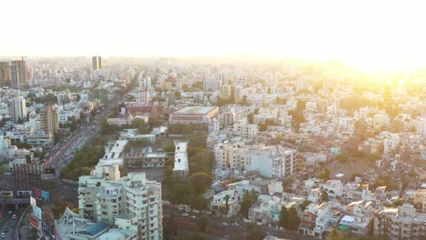 Aerial-drone-view-golden-hour-in-rajkot-where-many-temples-and-roads-are-visible