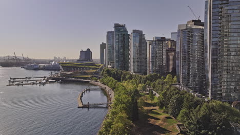 Vancouver-BC-Canada-Aerial-v88-drone-flyover-waterfront-promenades-towards-Eastside-shipyard-capturing-harbourfront-downtown-cityscape-and-landmark-buildings---Shot-with-Mavic-3-Pro-Cine---July-2023