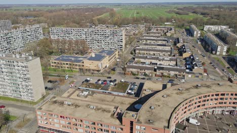 Aerial-of-a-large-suburban-neighborhood-with-high-rise-apartment-buildings-on-a-sunny-day