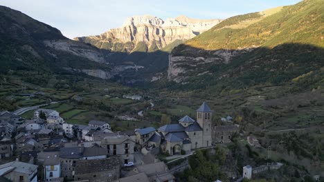 Torla-Mountain-Village-in-Ordesa-Y-Monte-Perdido-National-Park,-Pyrenees,-North-Spain---Aerial-4k