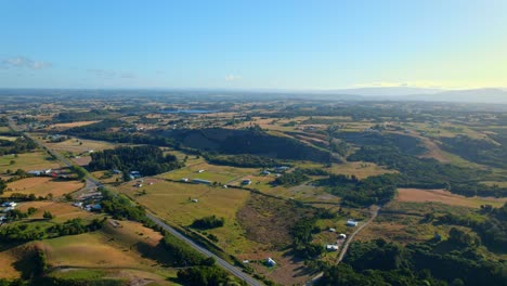 Aerial-Panorama-of-Chiloé-Island-Natural-landscape,-Sprawling-meadows-in-the-distance,-Chile