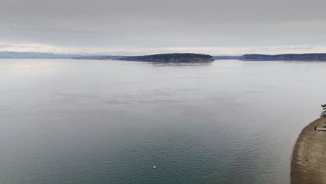 Aerial-shot-of-Wollochet-Bay-and-Puget-Sound-on-an-overcast-cloudy-day-in-Gig-Harbor,-Washington-State