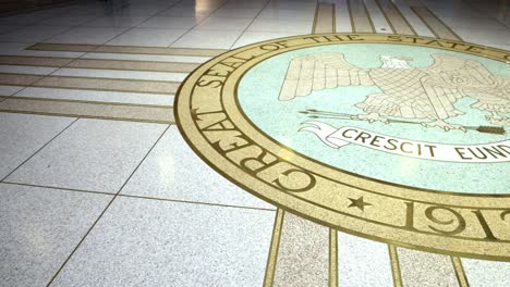 Inside-New-Mexico-capitol-building-in-Santa-Fe,-New-Mexico-showing-state-seal-with-video-panning-right-to-left