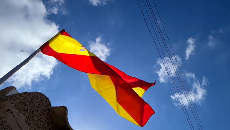 Spanish-National-Flag-Waving-on-Pole-on-Sunny-Day