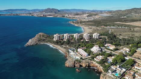 Beach-Hotels-and-Scenic-Coast-in-Isla-Plana,-Costa-Calida,-Cartagena,-Murcia,-Spain---Aerial-4k