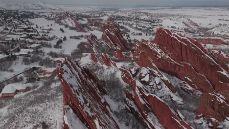 Fresh-snow-sunny-bluesky-Roxborogh-State-Park-Golf-Course-aerial-drone-Colorado-Front-Range-winter-spring-deep-powder-dramatic-sharp-red-rocks-mountain-landscape-Littleton-Denver-backwards-pan-up
