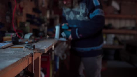 Unrecognizable-Man-Cutting-Wood-Plank-Using-Electrical-Cutting-Machine